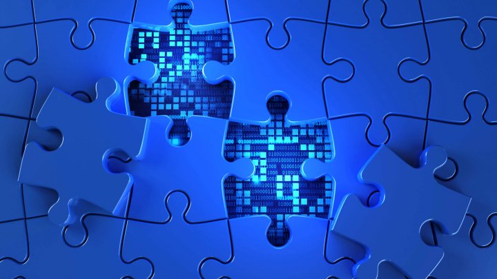 Blue jigsaw puzzle from the panel shows a background of tech code numbers. concept of technology and important parts for program design and business online network connection